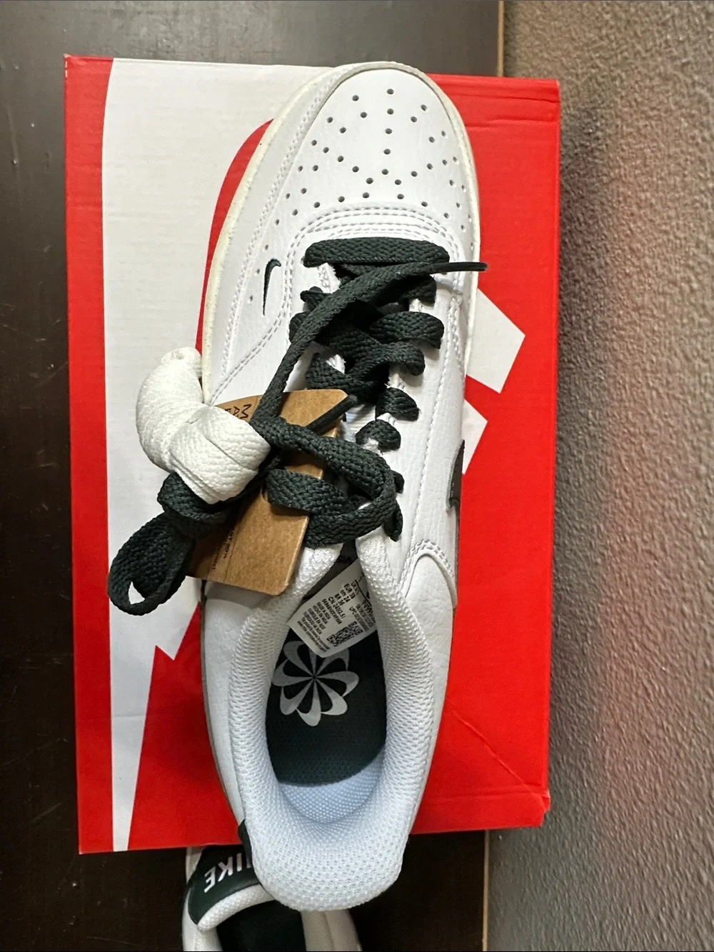 Nike White Low-Top Sneakers with Dark Green Swoosh and Heel